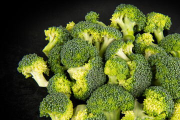 Fresh broccoli on a dark background. Top view.