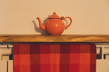 Detail of shelf with old teapot, close up