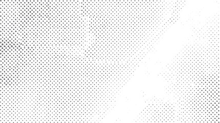 Abstract grayscale halftone dot pattern fading from dense to sparse on white background texture