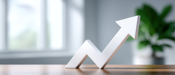 Stable financial white arrow growth chart sculpture on office desk with plant