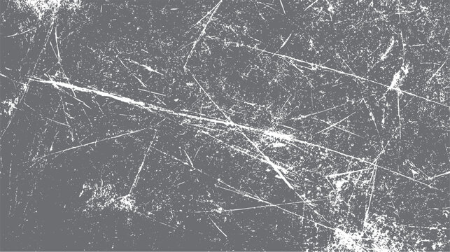 Detailed close up of a distressed grey textured surface with white scratches and speckles creating a grunge effect