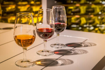 port wine testing, glasses with drink - white and red