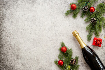 Christmas and New Year festive flat lay with champagne bottle and decoration, top view