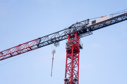 Construction tower crane against clear blue sky