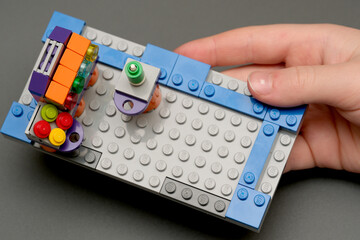 Naklejka premium Creative LEGO building on a small gray base with colorful elements