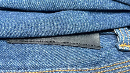 close-up of folded jeans on a rack