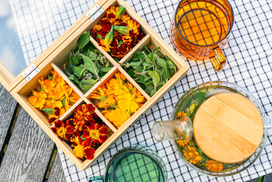 Homemade herbal tea with mint, calendula, and marigold