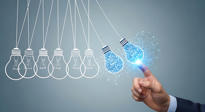 A finger touches a glowing lightbulb in a Newton's cradle, symbolizing innovation.