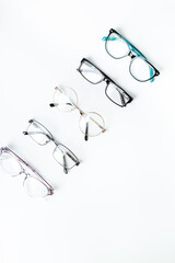 Eye care concept. Group of glasses on white background