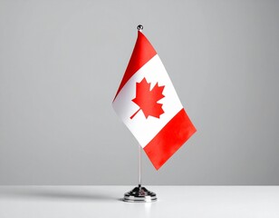 Small National Tabletop Flag with Red Maple Leaf Design on Stand