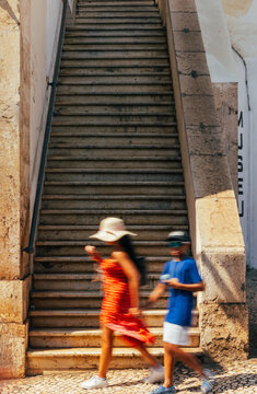 Historic stone staircase in Lisbon's vibrant street