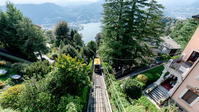 Funicular ride through lush landscape in Como, Italy