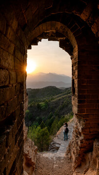 Gubeikou Great Wall at sunset through ancient archway