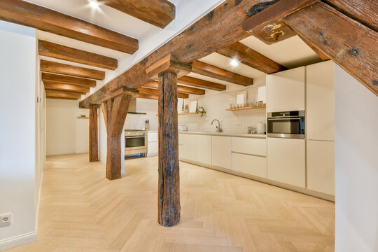 Modern kitchen with rustic exposed wooden beams