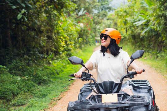 Woman exploring Mindo on an ATV ride in Ecuador