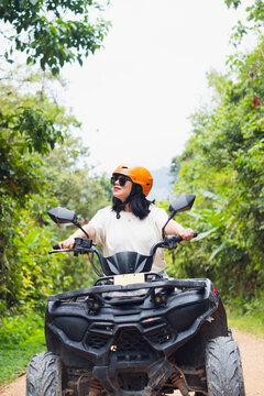 Woman exploring in ATV the lush trails of Mindo, Ecuador