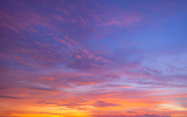 Clouds and sky backdrop at sunset and sunrise,Sunset Sky Clouds in the evening with Red, Orange, Yellow and purple sunlight on Golden hour after sundown, Romantic sky in summer on Dusk Twilight 