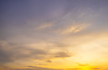 Fototapeta premium Clouds and orange sky backdrop,Sky,sunset, beautiful , luxury soft gradient orange gold clouds and sunlight on the blue sky perfect for the background, wilight summer,silhouette.