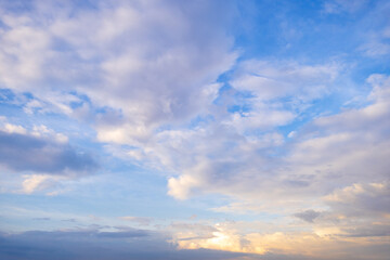 Obraz premium Colorful orange clouds and sky in the morning,Clouds and orange sky,Real majestic sunrise sunset sky background with gentle colorful clouds without birds.Panorama, large