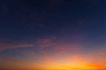 Clouds and sky backdrop at sunset and sunrise,Sunset Sky Clouds in the evening with Red, Orange, Yellow and purple sunlight on Golden hour after sundown, Romantic sky in summer on Dusk Twilight 
