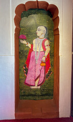 Traditional mural of a Hindu devotee offering flowers, painted on the walls of Nana Fadnavis Wada...