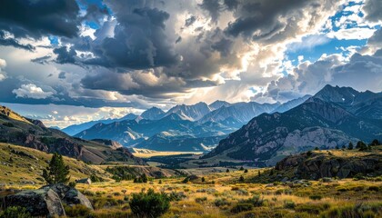 Dramatic Mountain Landscape Under Stormy Sky with Sunlight Bursting Through Clouds