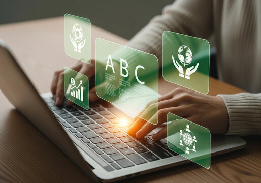 Businesswoman using a laptop with a virtual interface displaying ESG (Environmental, Social, and Governance) icons for sustainable and ethical business.