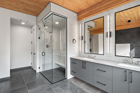 Bathroom with a glass shower stall and a large mirror
