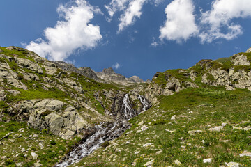 View on a waterfall in the Lauzière massif , Savoie , France 