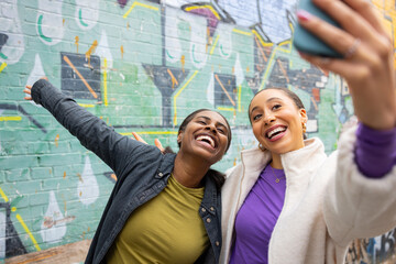 Friends Taking Selfie in a Colorful Urban Setting
