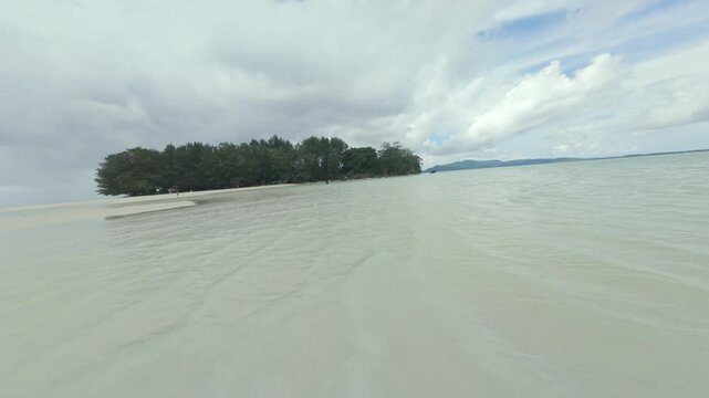 Dynamic FPV Drone Shot Soaring Over Pristine Tropical Beaches and Island Scenery of Karimunjawa