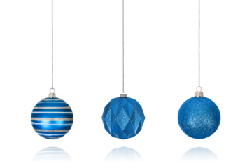 Set of Christmas decorations in form of striped blue ball on string, shiny ball and ball with geometric pattern isolated on transparent background with clipping path. Design element for Christmas card