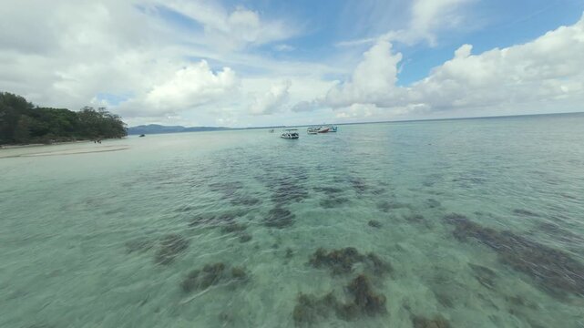 Dynamic FPV Drone Shot Soaring Over Pristine Tropical Beaches and Island Scenery of Karimunjawa