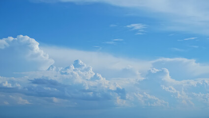 Vast expanse of fluffy white cumulus clouds against a brilliant blue sky showcasing nature s beautiful atmospheric artistry and serene aerial views