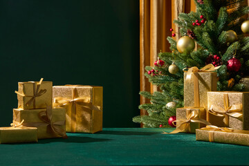 Gold holiday gifts placed on a green surface with soft tree lighting. The contrast between green and gold gives the scene a premium Christmas style.