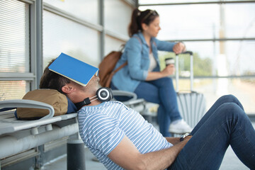 a student is resting on bench