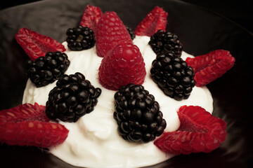 
Yogurt with blackberries and raspberry fruits                              