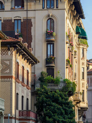 Historic residential buildings along via Eupili in Milan, Italy