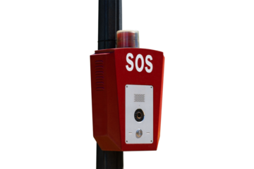 Bright red emergency SOS phone station with an alert light on top