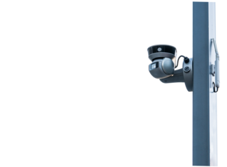 CCTV camera mounted on a vertical surface for surveillance in an urban setting during daytime