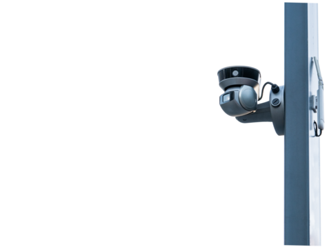 CCTV camera mounted on a vertical surface for surveillance in an urban setting during daytime