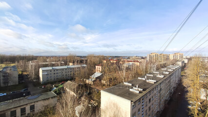 An elevated city perspective shows roads, cars, and dense architecture. The view reflects activity, structure, and everyday metropolitan life.