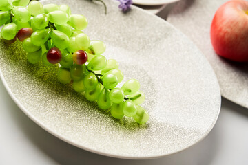 Fake grape ornaments and ceramic vessels