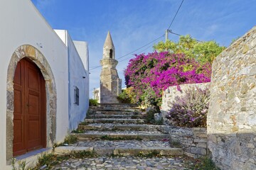Path, paved with steps, northwestern minaret, formerly Bab Gedid Mosque, built in 1585, destroyed by earthquake in 1933, relic, door, house, white, bougainvillea, pink, old town, city of Kos, Dodecanese islands, eastern Aegean Sea, Greece