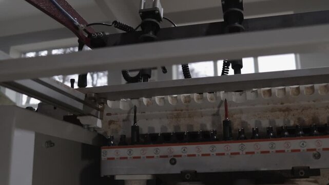 Milling cutter close-up in a woodworking machine. Concept of professional equipment for furniture making