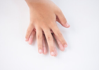 Fototapeta premium Hands of a child on a white background, close-up
