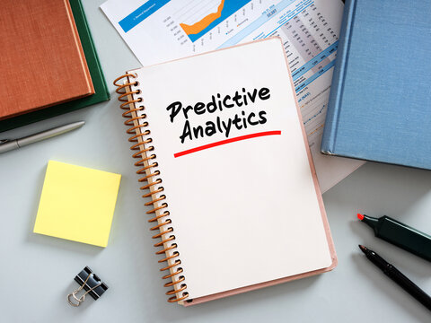 Manager planning predictive analytics strategy using data analysis reports
