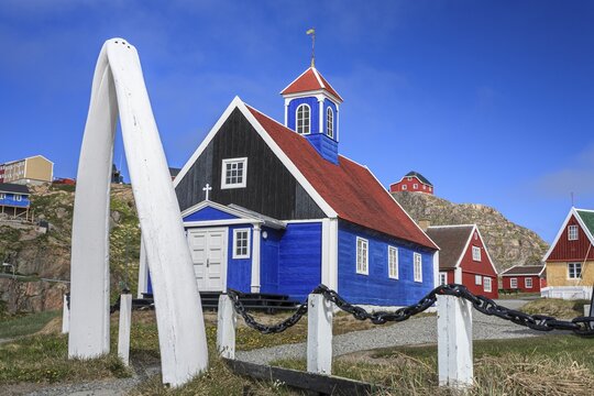 Historical building and whale bones in front of a blue sky, Museum, Sisimiut, West Greenland, Greenland