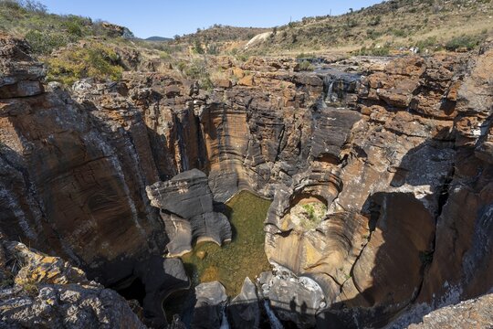 Canyon with steep orange-coloured cliffs with the Blyde River, Bourke's Luck Potholes, Panorama Route, Mpumalanga, South Africa