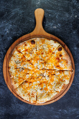 Cheesy Chicken Pizza On Wooden Board With Golden Crust And Melted Cheese